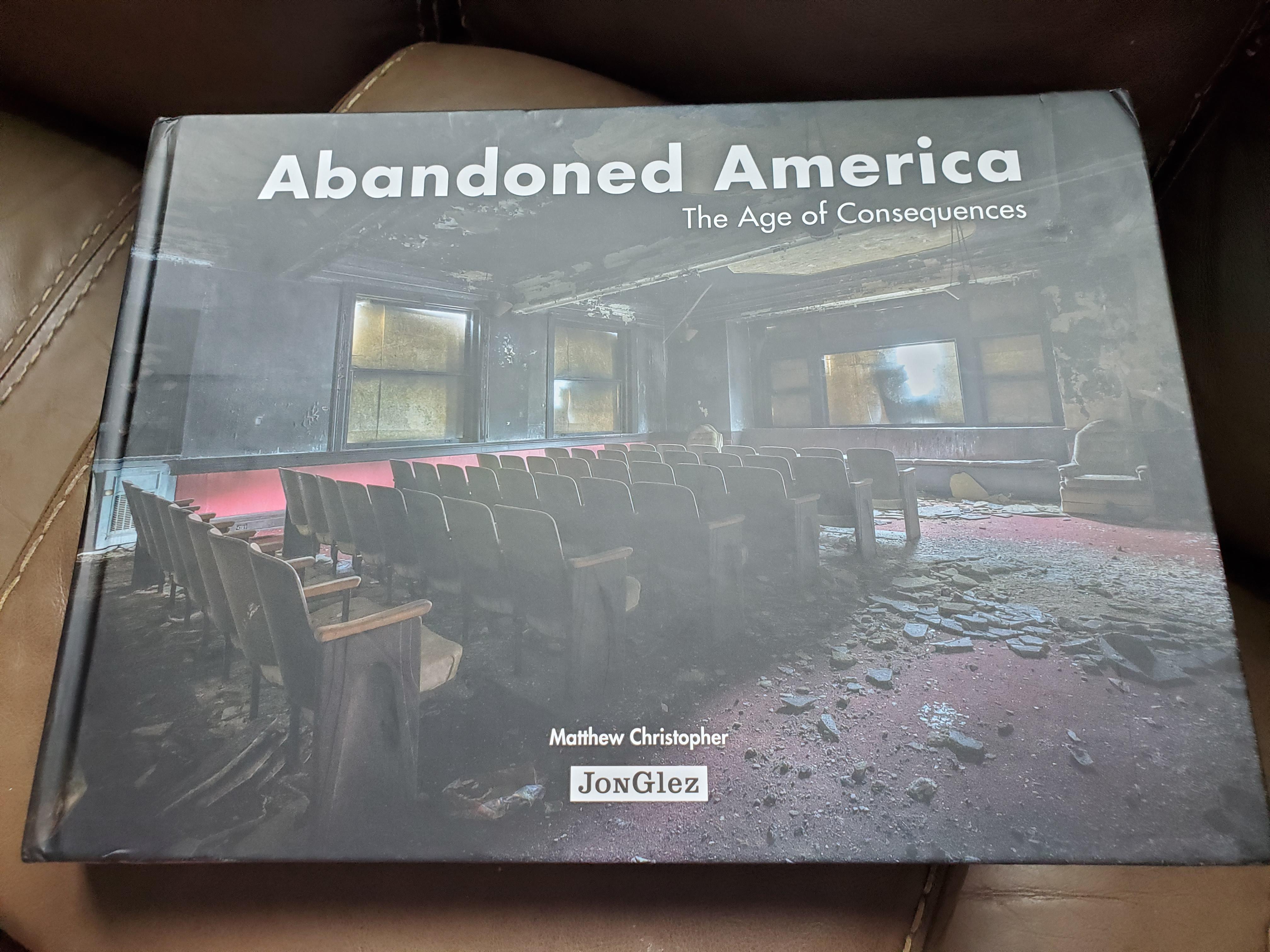 A hardcover copy of "Abandoned America: The Age of Consequences" by Matthew Christopher