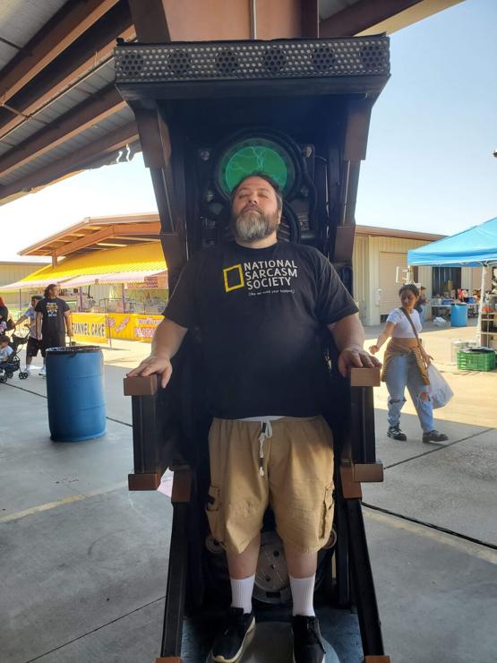 A middle-aged man with gray and brown beard stands in a Borg Regeneration Chamber