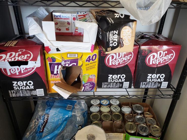 A shelf of drinks. Visible are three cases of Dr. Pepper Zero, one case of Dr. Pepper Zero Creme Soda and one case of children's fruit juice.